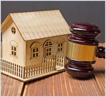 gavel and small house
